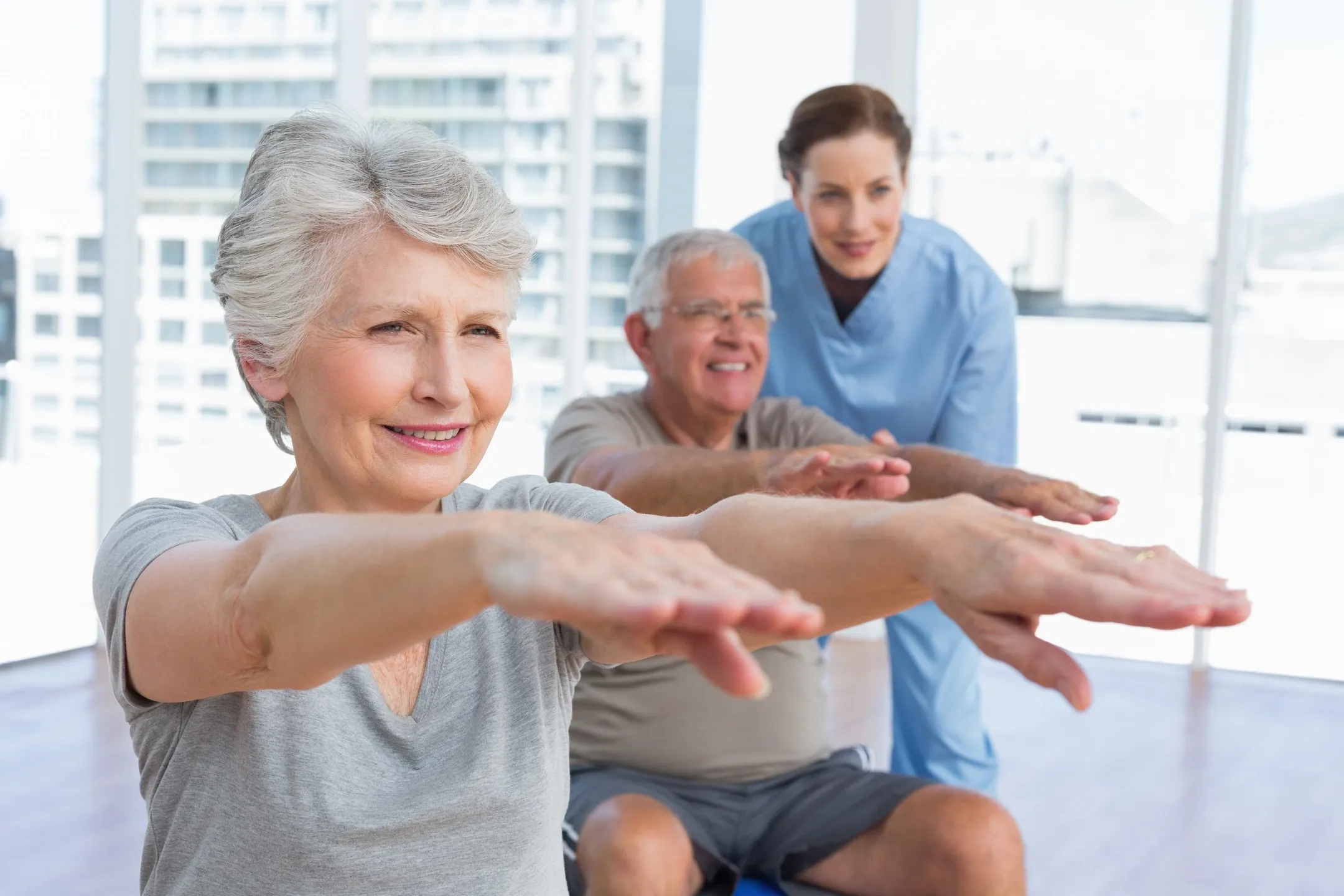 A group of people doing different exercises together.