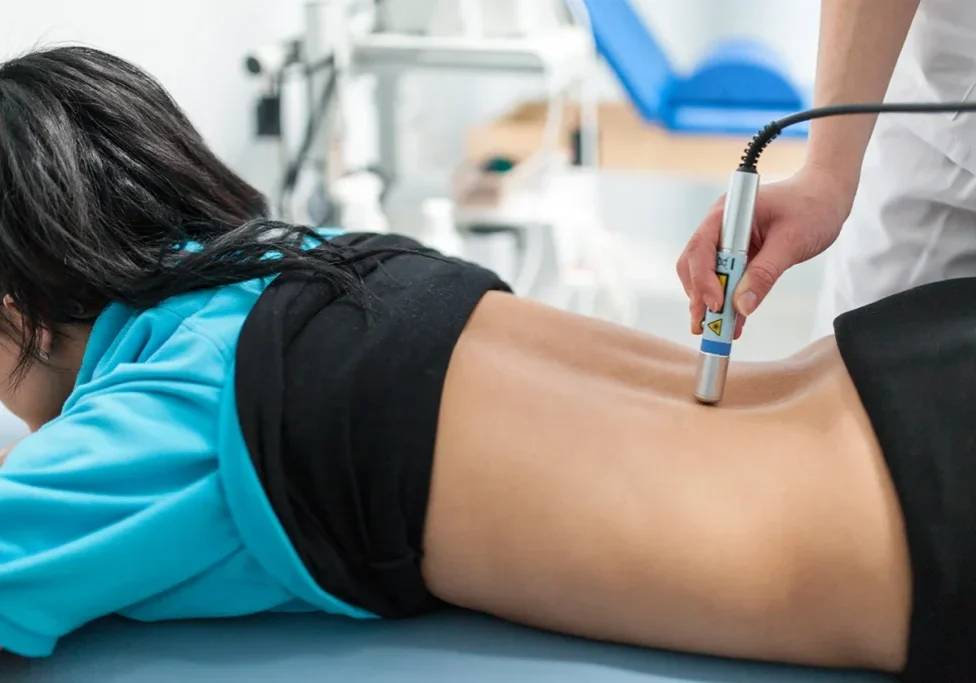 A person is getting their leg examined by an electrologist.