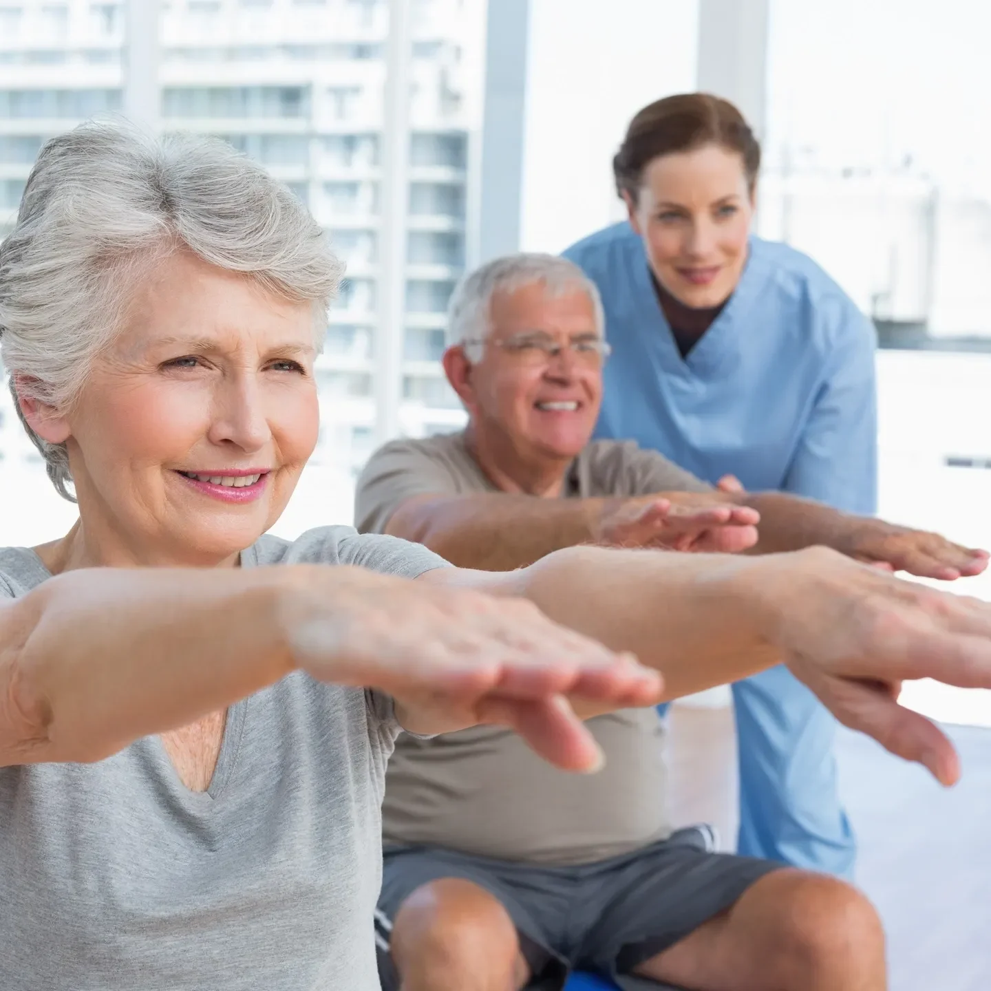 A group of people doing different exercises together.