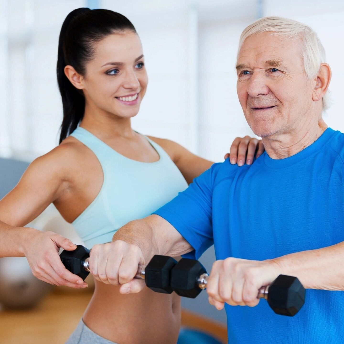 A woman and an older man are doing exercises.