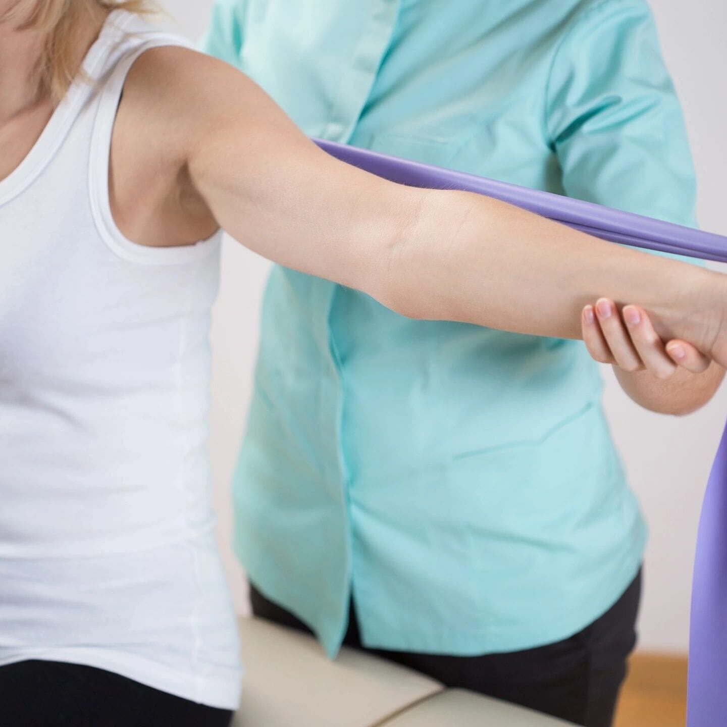 A woman is holding onto a purple object
