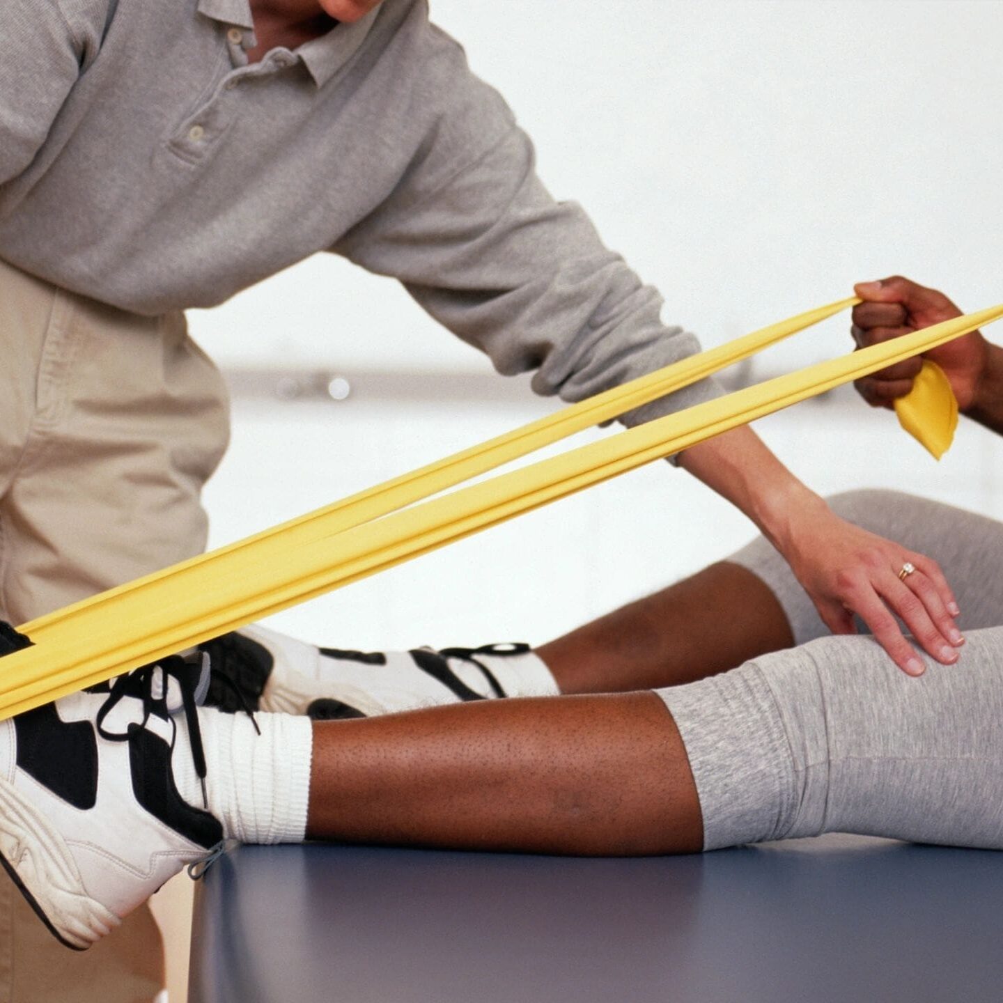 A person is holding onto a yellow band