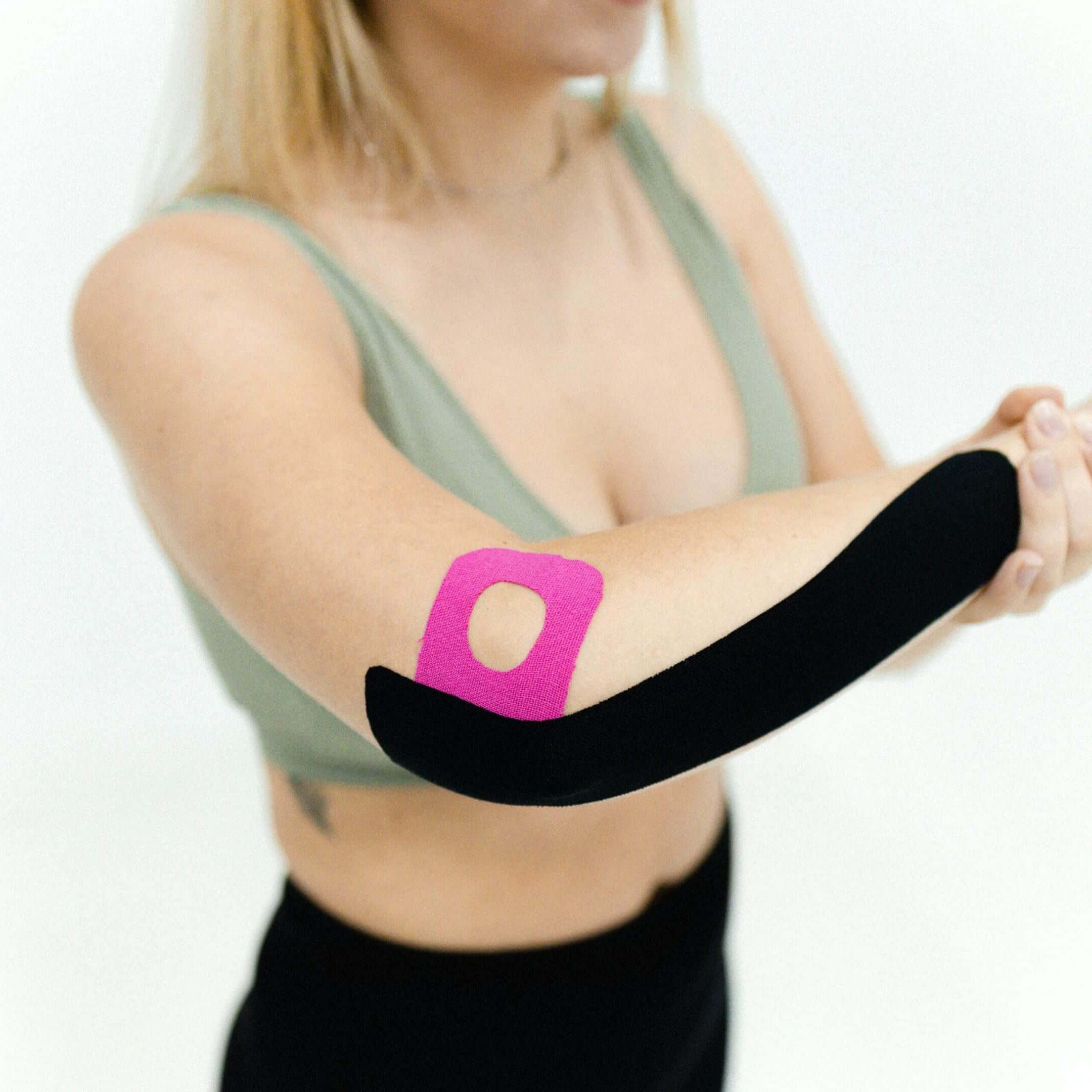 A woman with a pink patch on her arm.